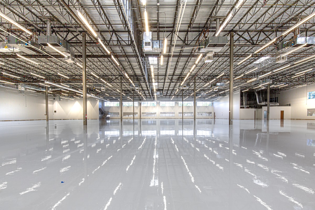 warehouse interior with LED high bay lights and occupancy sensors