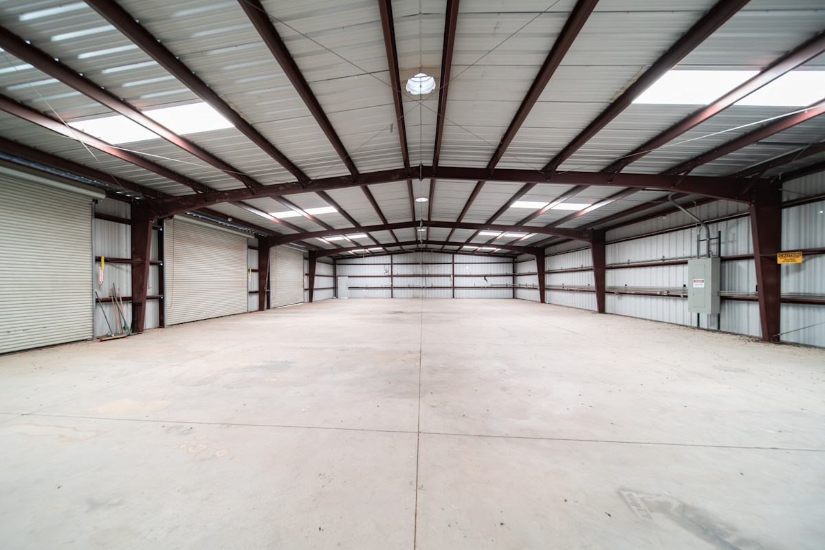 large industrial warehouse with high-bay LED lighting fixtures ready for DALI-2 certified control integration