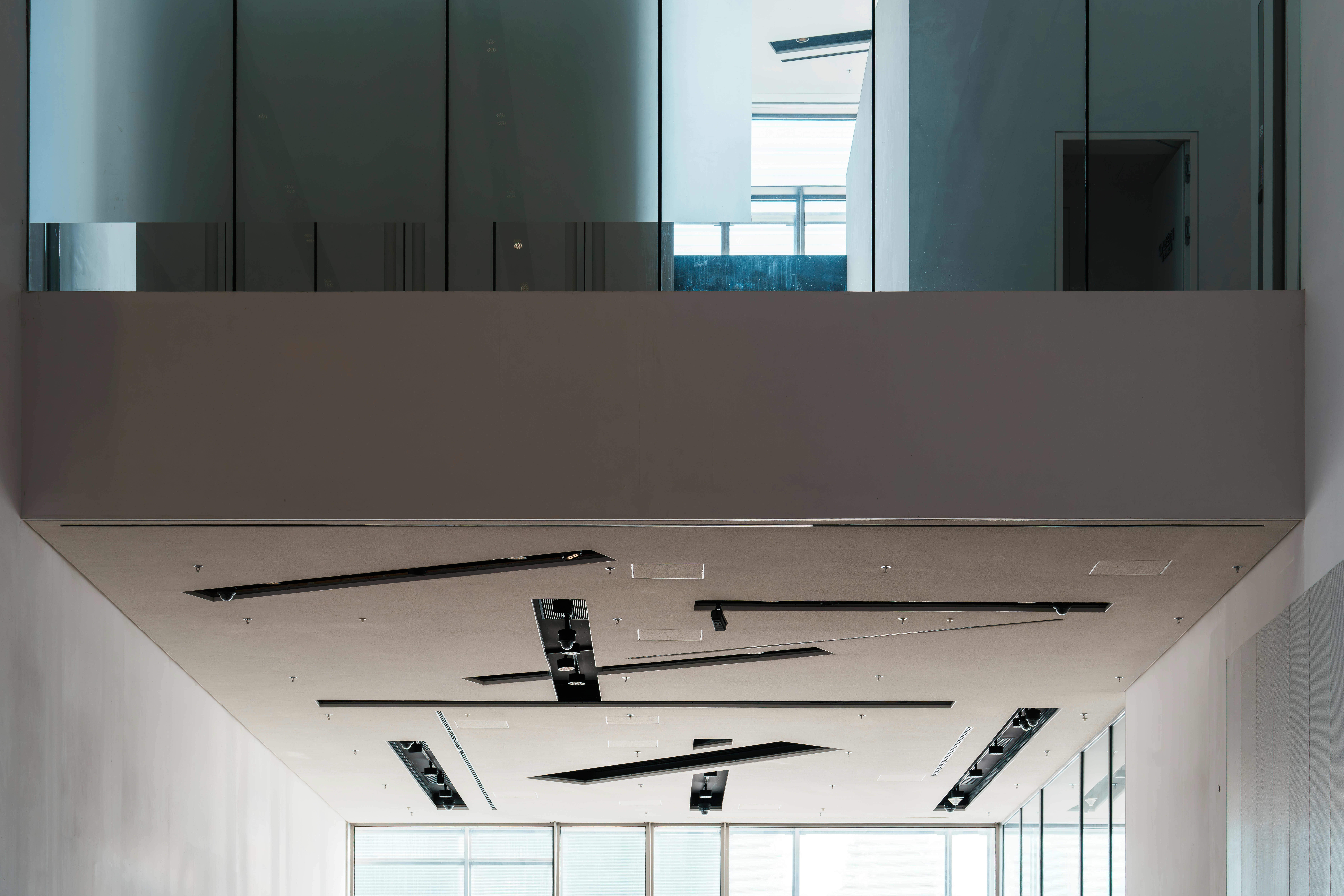 modern office space with linear LED ceiling panels providing even illumination