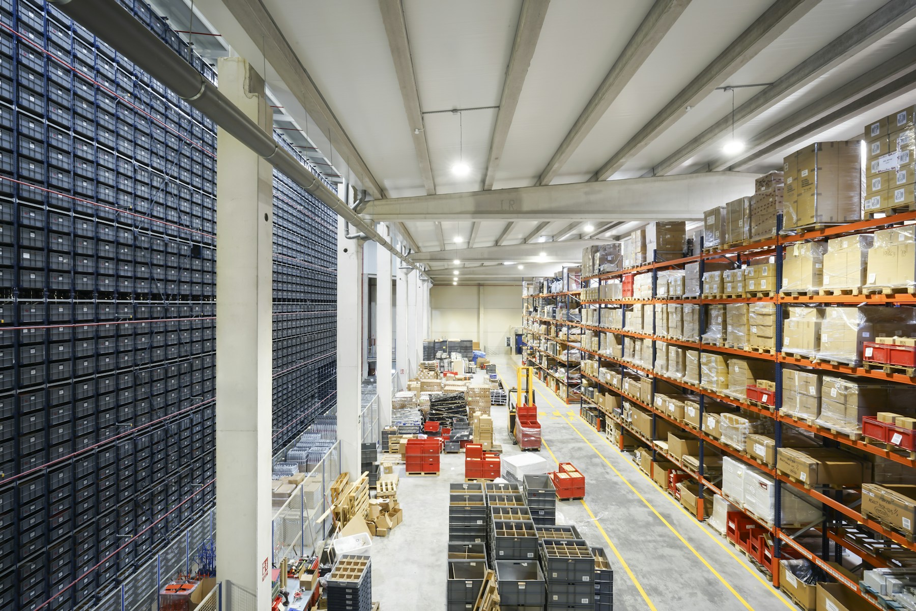Industrial warehouse lit by high-bay LED fixtures with uniform illumination