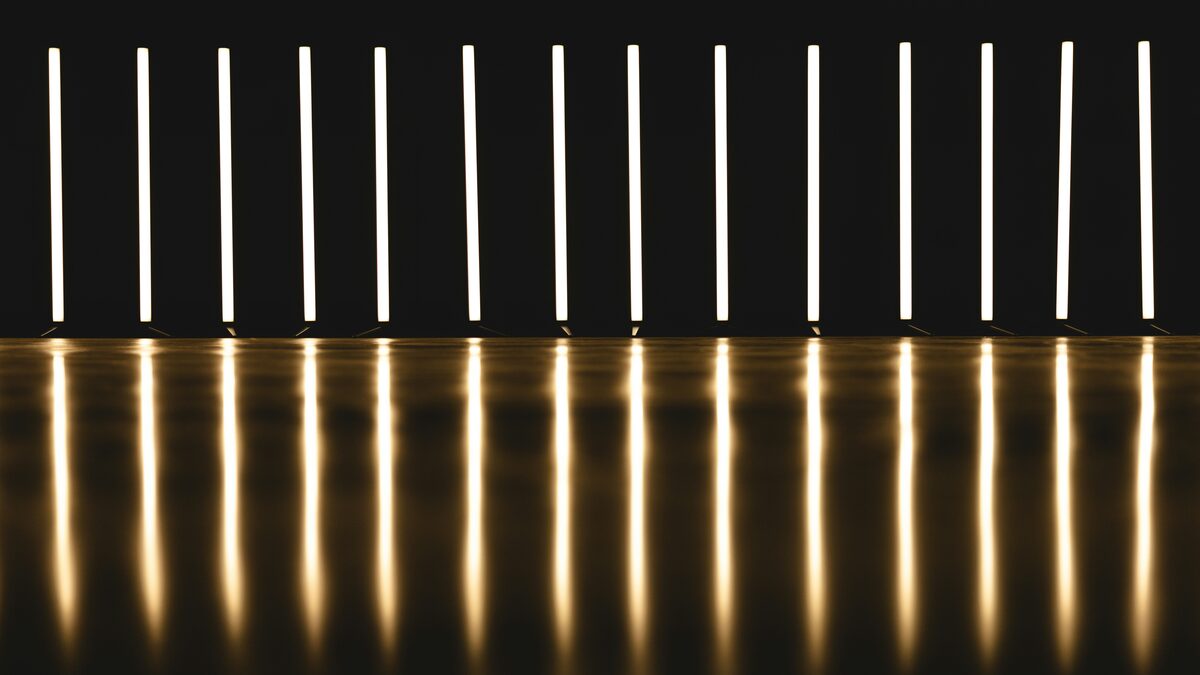 Row of LED linear fixtures in a commercial ceiling installation