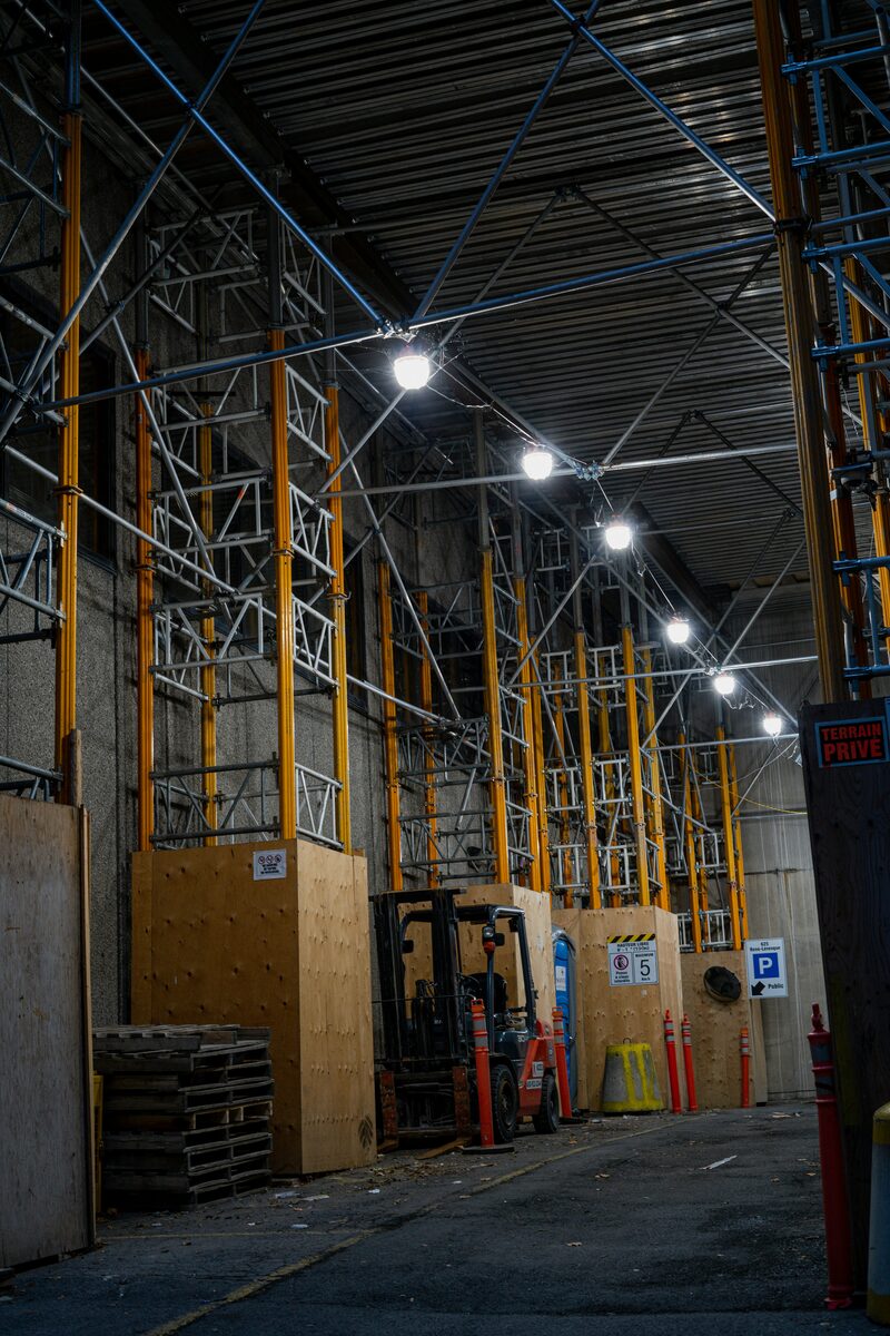 Industrial warehouse illuminated by high-bay LED fixtures under EU 2026 compliance rules