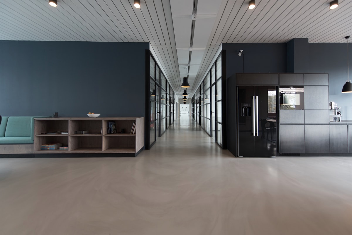 modern commercial office building with LED ceiling lighting and large windows