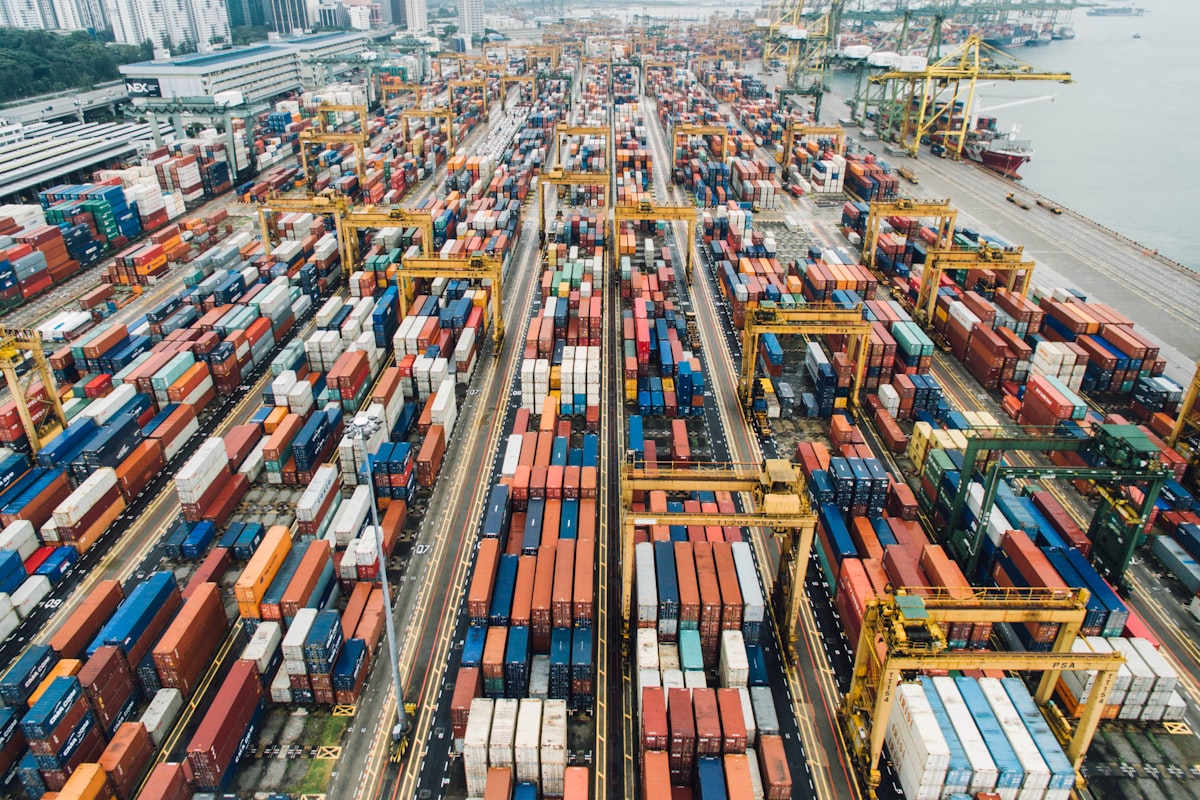 cargo containers at international shipping port ready for LED lighting import
