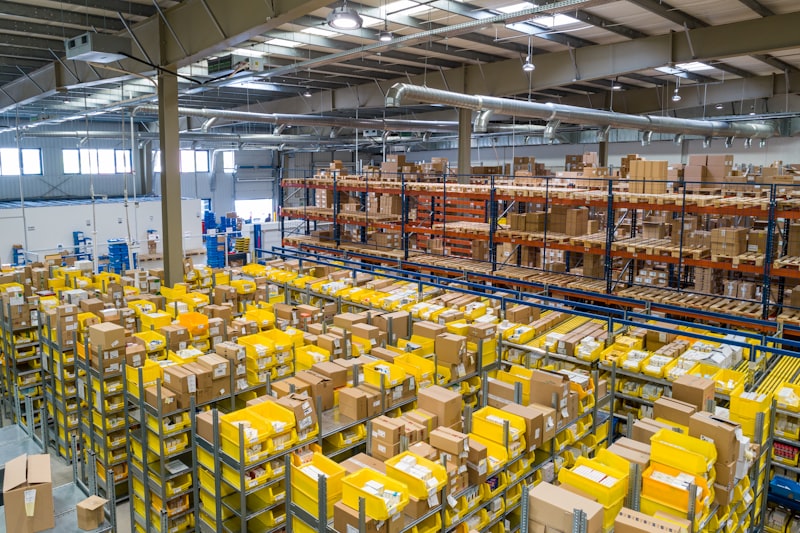 Industrial workshop with overhead LED tube lighting illuminating work areas