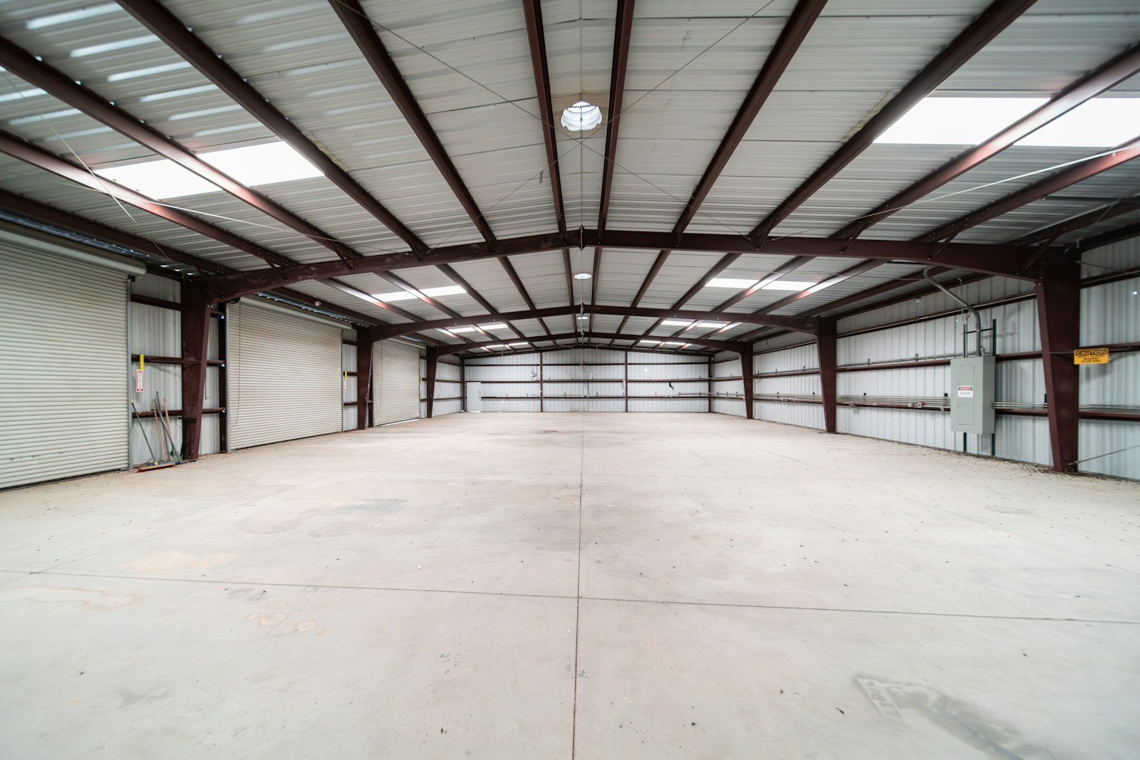 Empty industrial warehouse with polished floor ready for lighting upgrade