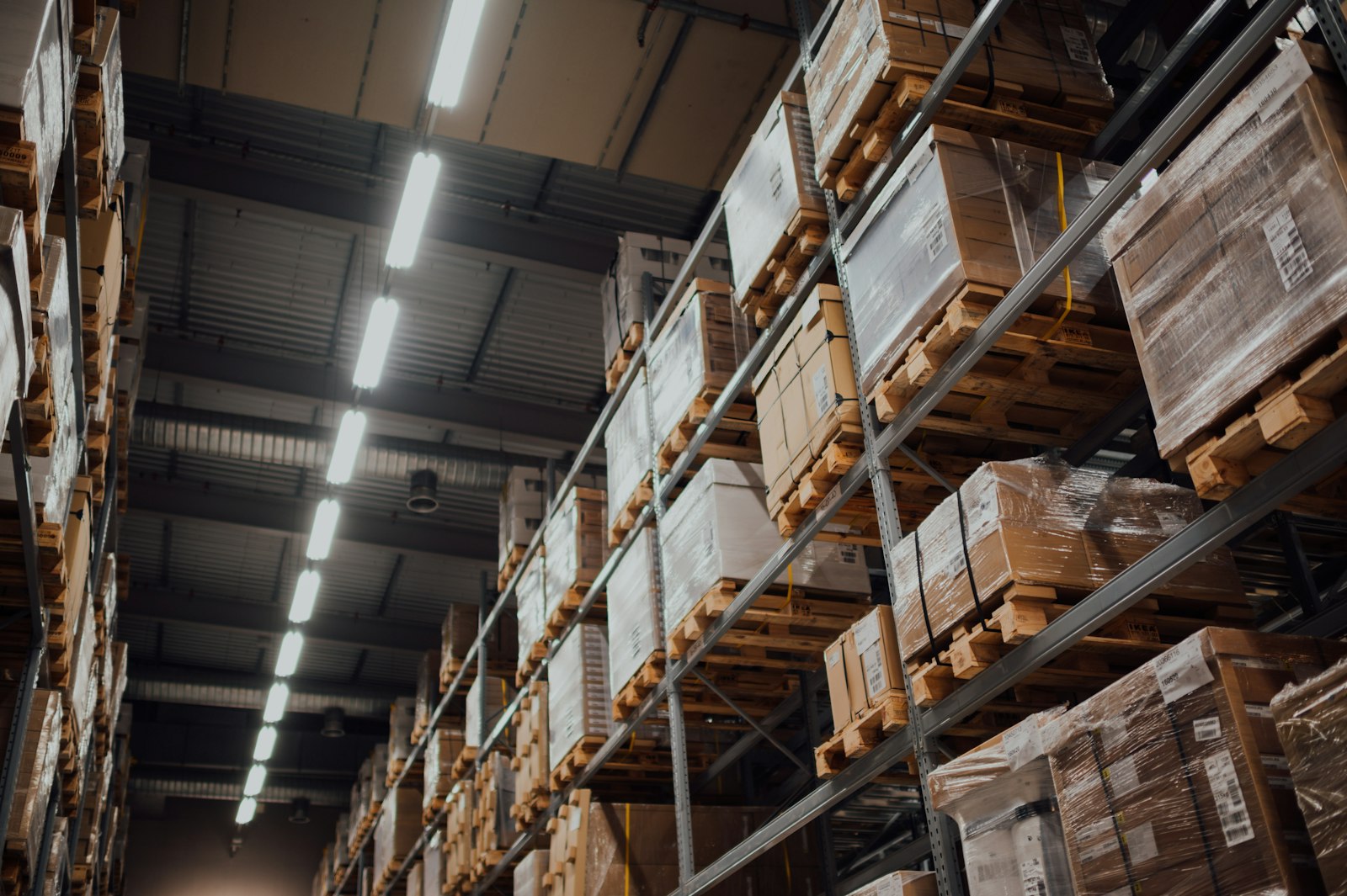 warehouse interior with high-bay LED lighting meeting JA8 high-efficacy standards for commercial applications