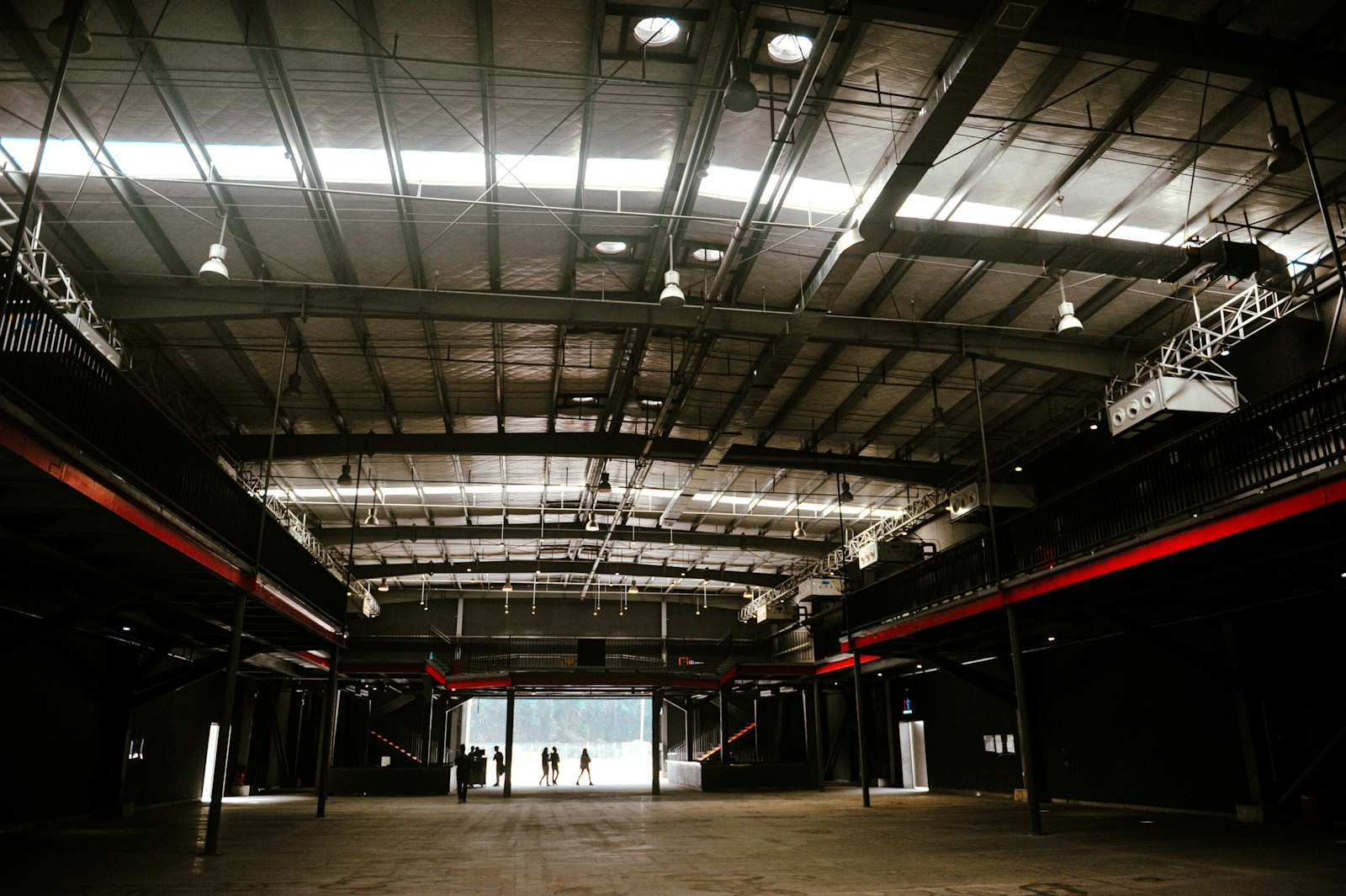 spacious open-plan industrial interior with bright overhead lighting suited to UFO high-bay fixtures